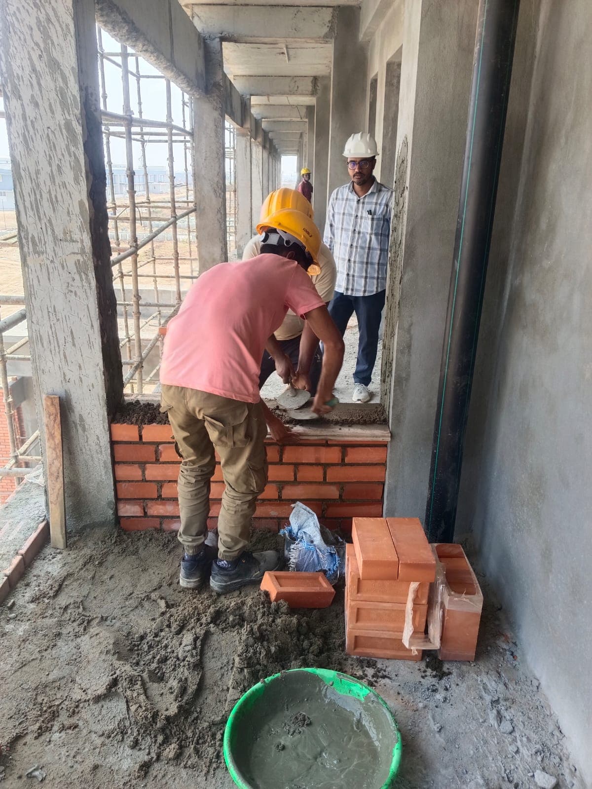 Civil Site Engineer Directing Masonry Work
